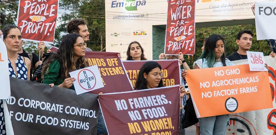 Climate activists at COP30 confront industry lobbyists at AgriZone. Source: worldanimalprotection 